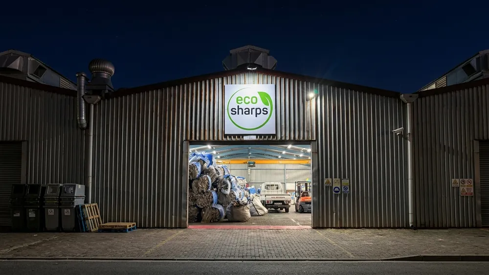 The EcoSharps facility at night, with baled material inside the loading bay